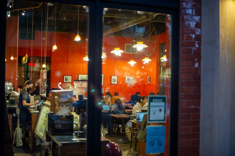 Photo of cafe in downtown Davis filled with patrons.